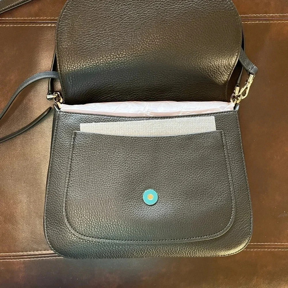 This is a NWT Kate Spade purse in black pebble leather with gold furnishings. - Picture 3 of 9